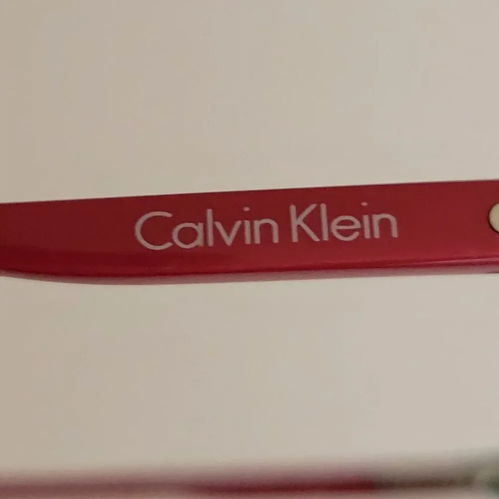 Calvin Klein CK59561 model featuring a black and red frame design 53X17X140